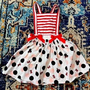 Girls Minnie Mouse skirt/overall outfit. Adjustable strap. Brand new